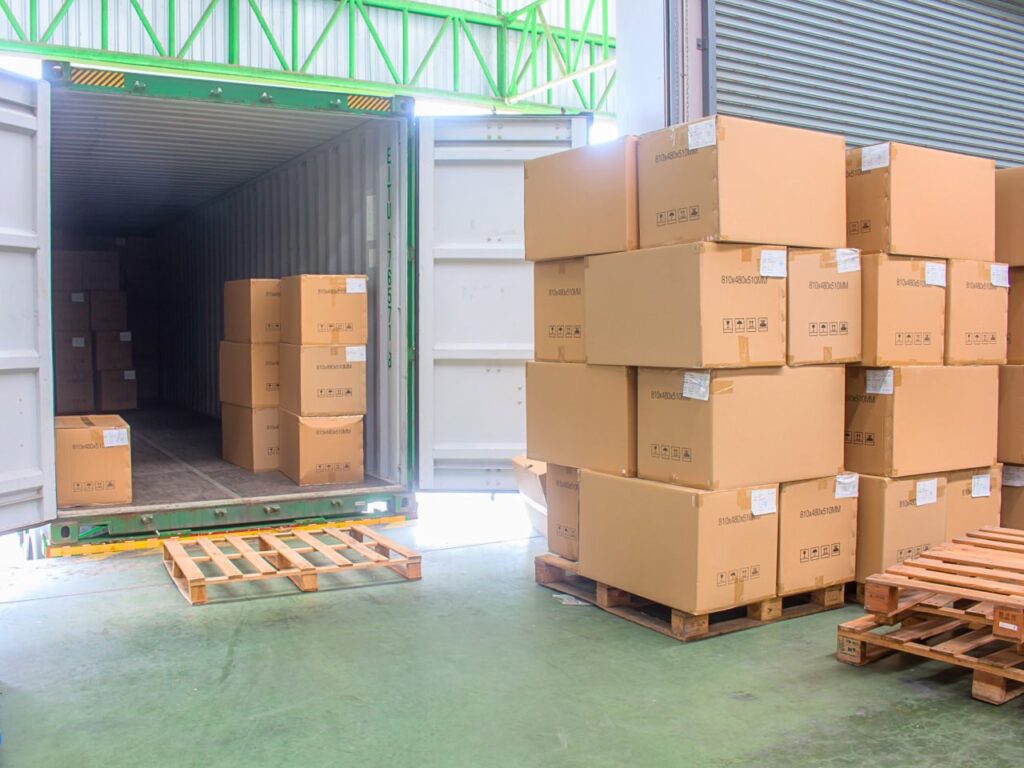 Amazon FBA inbound receiving — container unloading, carton sorting, and product inspection.