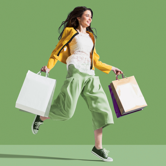 Laserlogix 3PL package forwarding — woman carrying shopping bags representing international shopping and shipping from the USA.